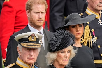 Britain's King Charles III, Camilla, the Queen Consort, Prince Harry and Meghan, Duke and Duchess of Sussex, watch as Queen Elizabeth II's coffin is placed in a hearse at Westminster Abbey, Monday, September 19, 2022 ( AP Photo/Martin Meissner)