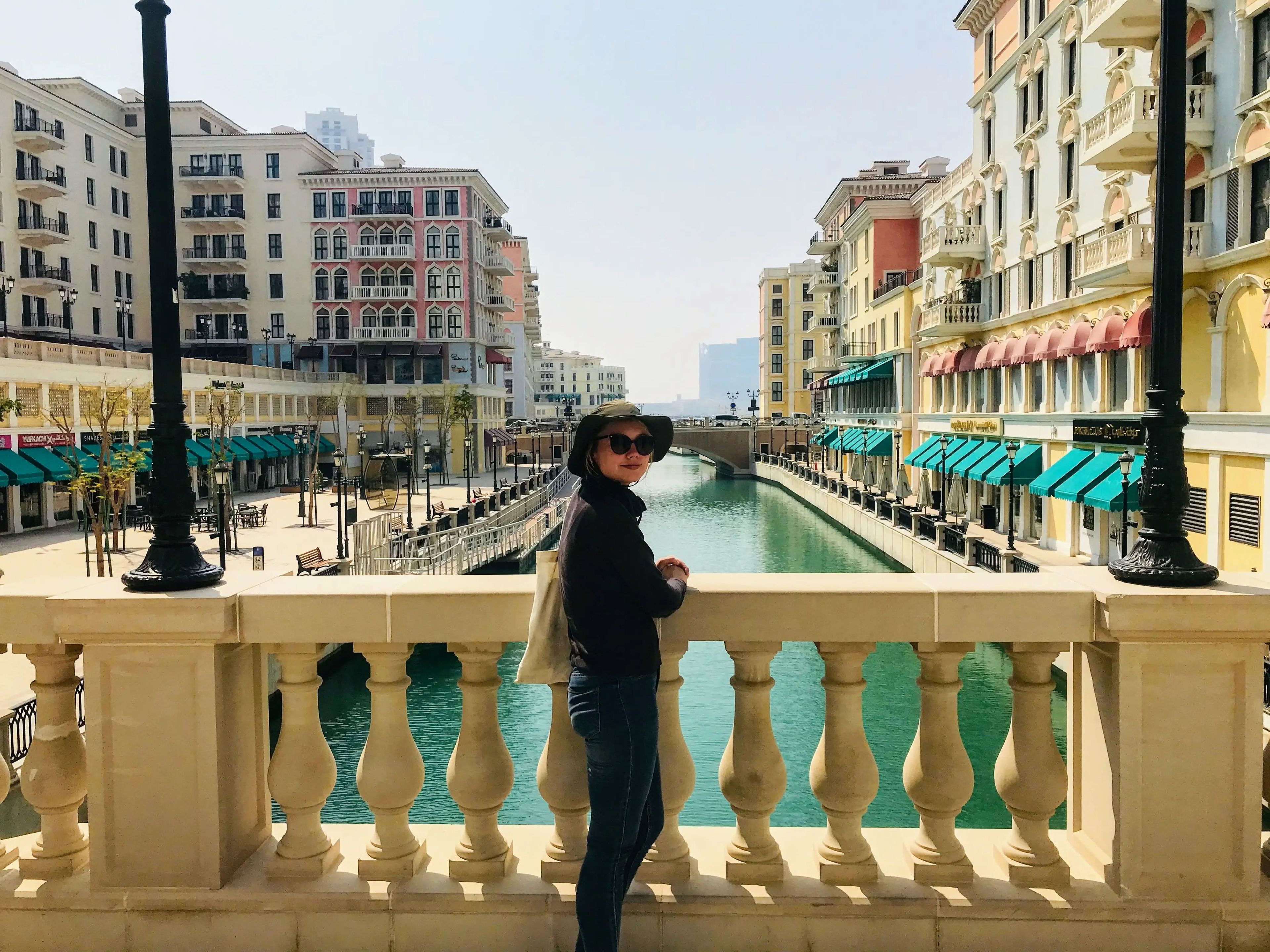 Jennifer Sizeland standing on a bridge overlooking water.