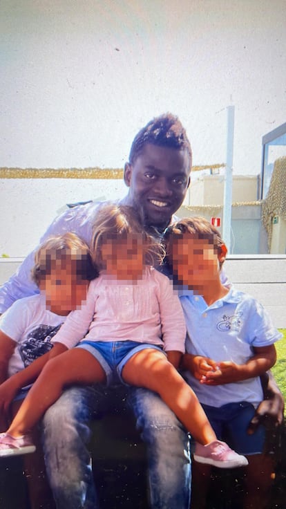 Mamady Diallo with Javier Muñoz-Calero's three children in an image provided by them.