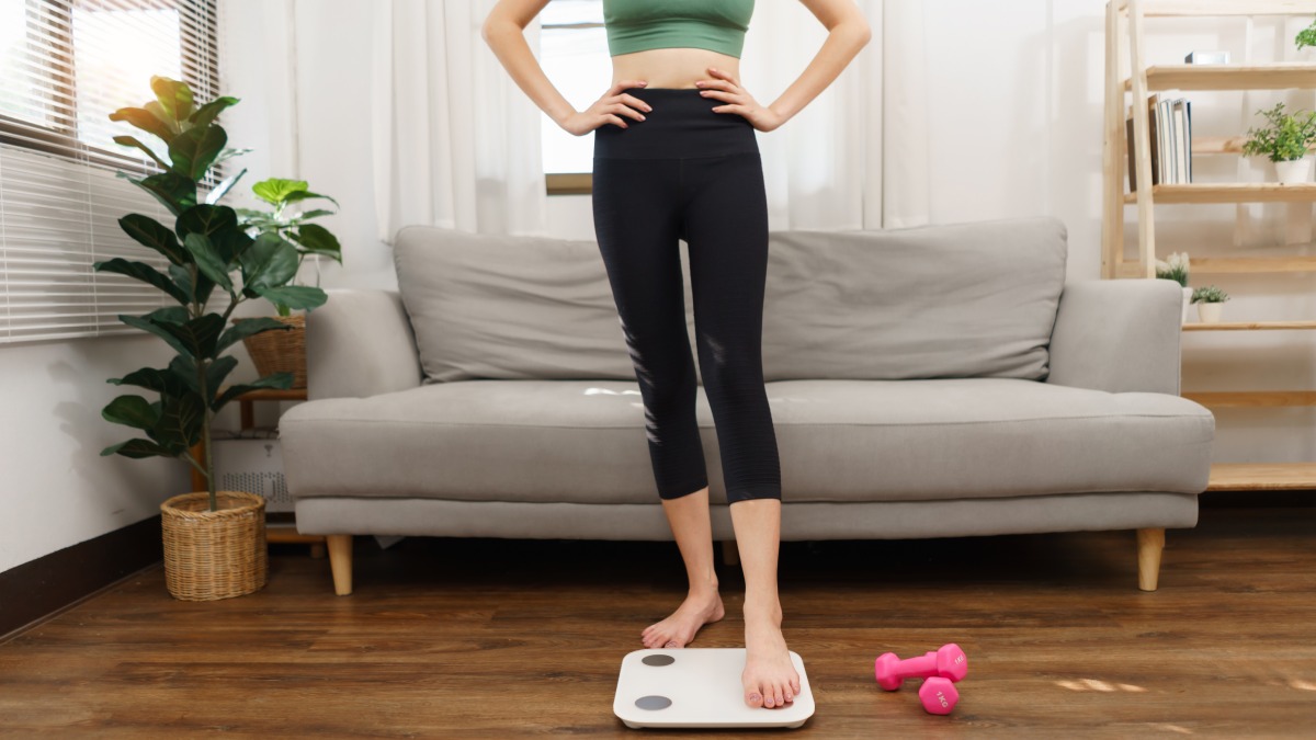 woman weighing herself